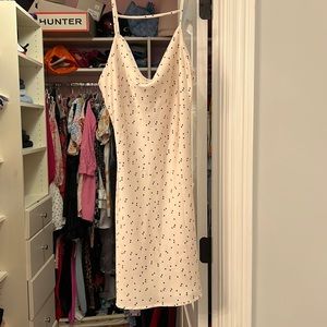 white dress with black stars… cowl neck.
